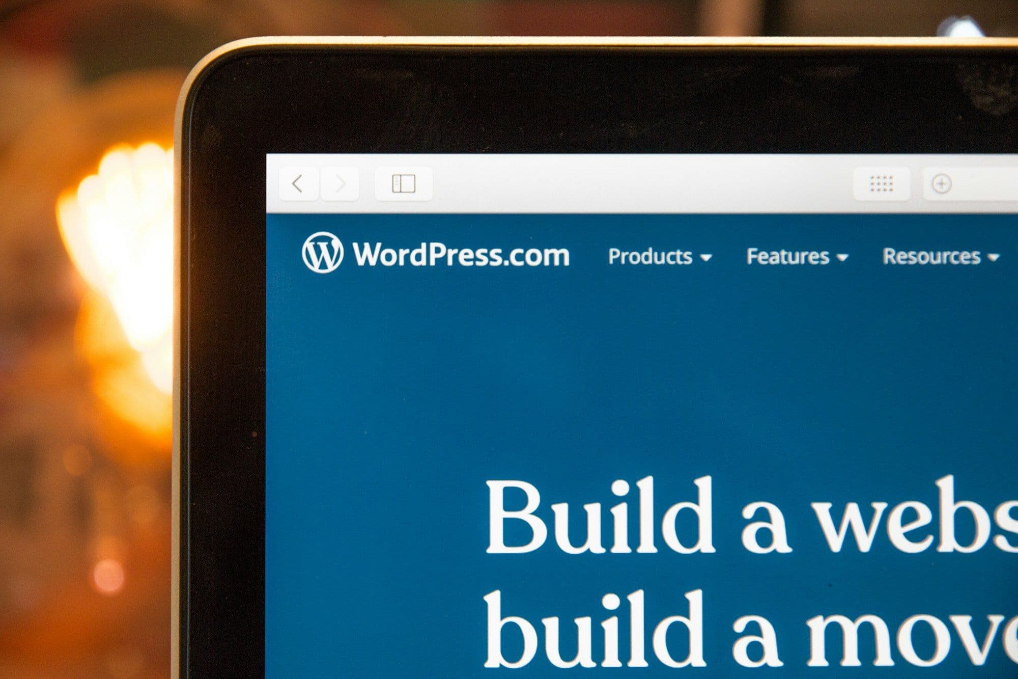The WordPress.com website open on a laptop screen